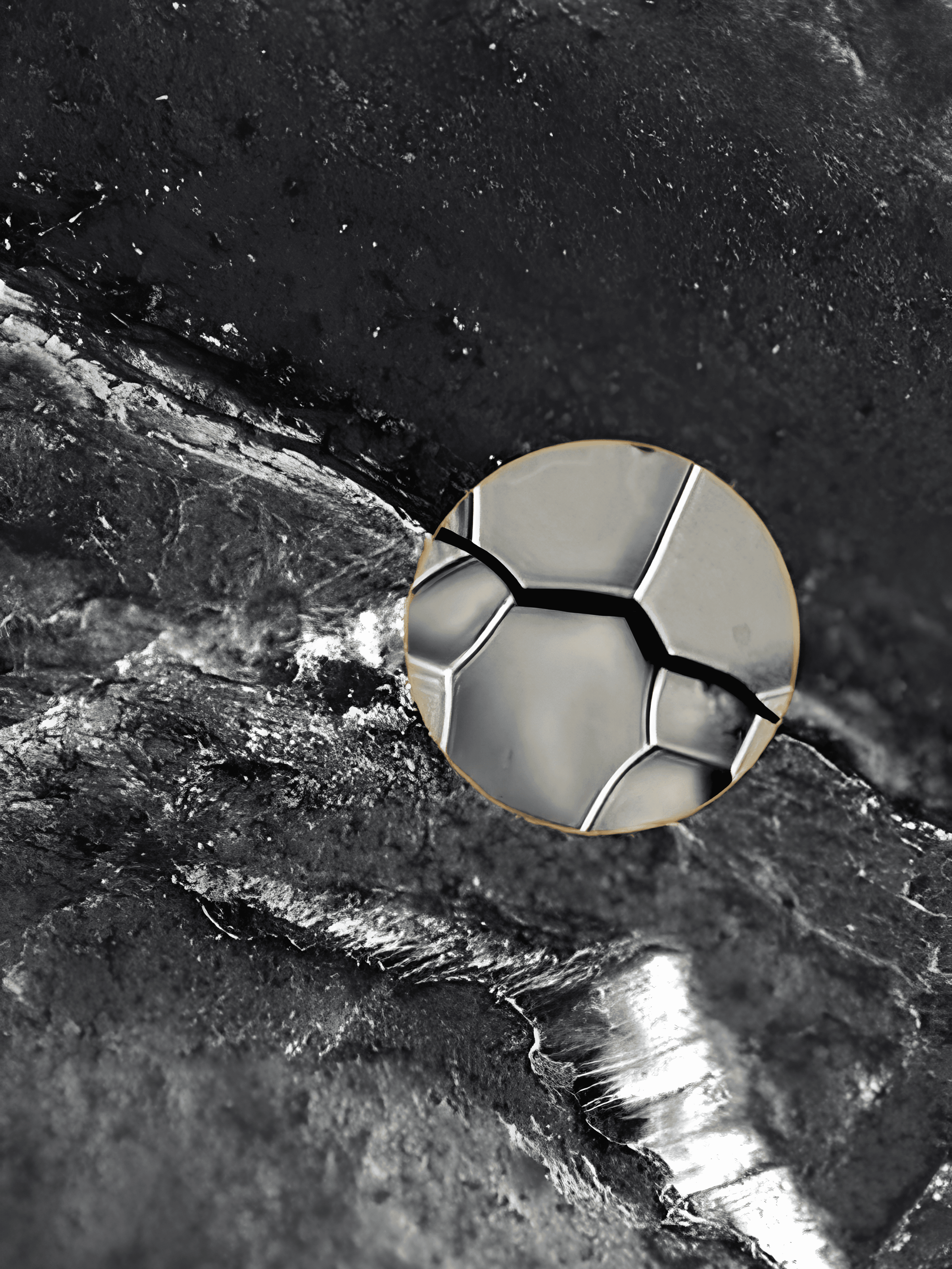 Close-up of a cracked metal surface with a magnified grain-boundary view illustrating hydrogen embrittlement and intergranular crack propagation.