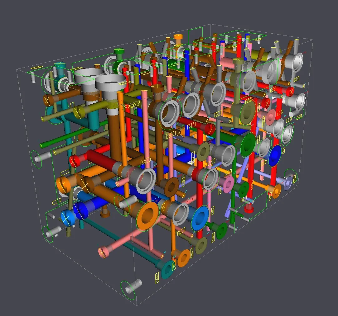3D model of a hydraulic manifold block with colour-coded internal drillings, valve cavities and ports (HydroMan stock image)