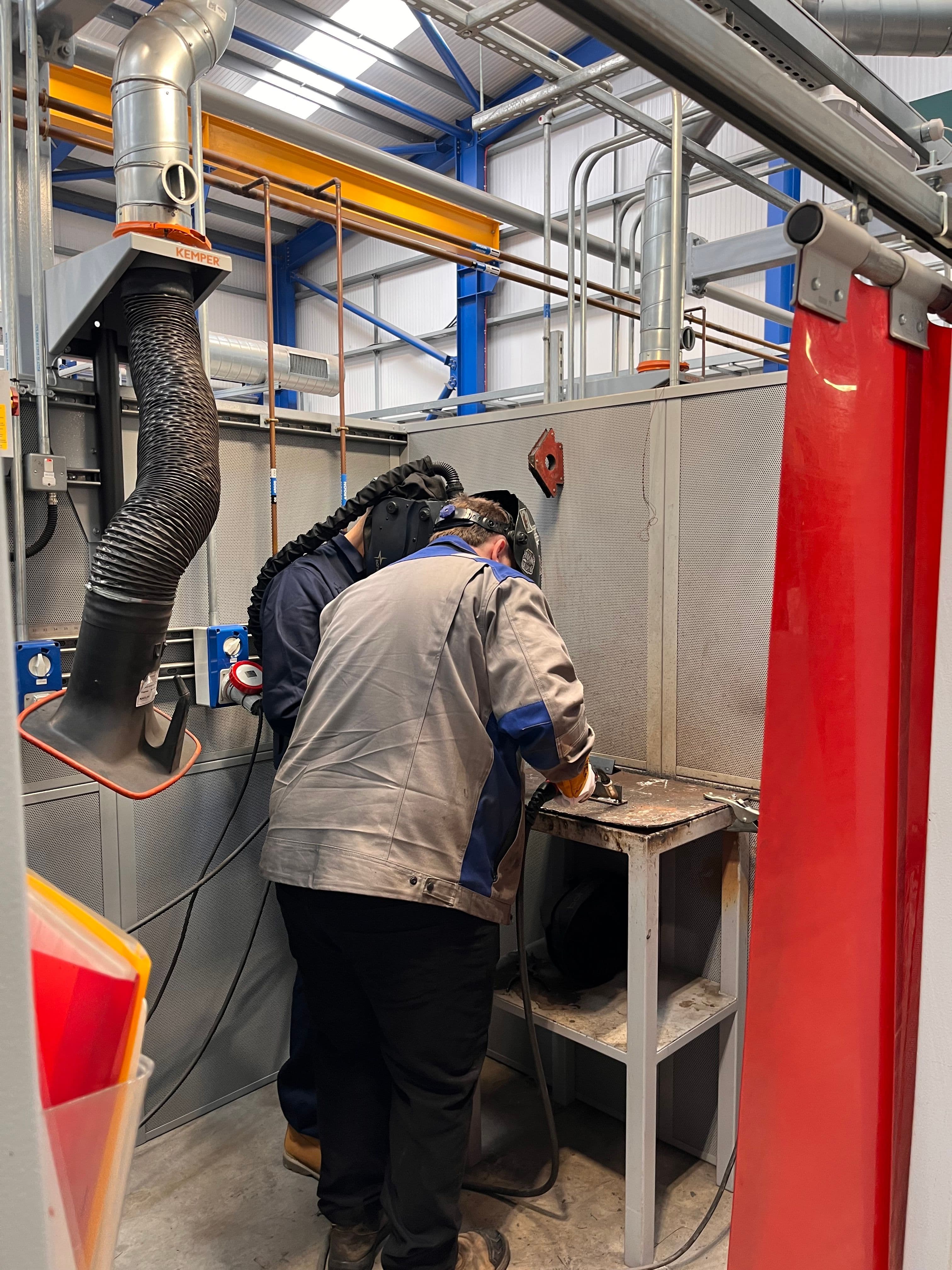 Subco team in welding overalls