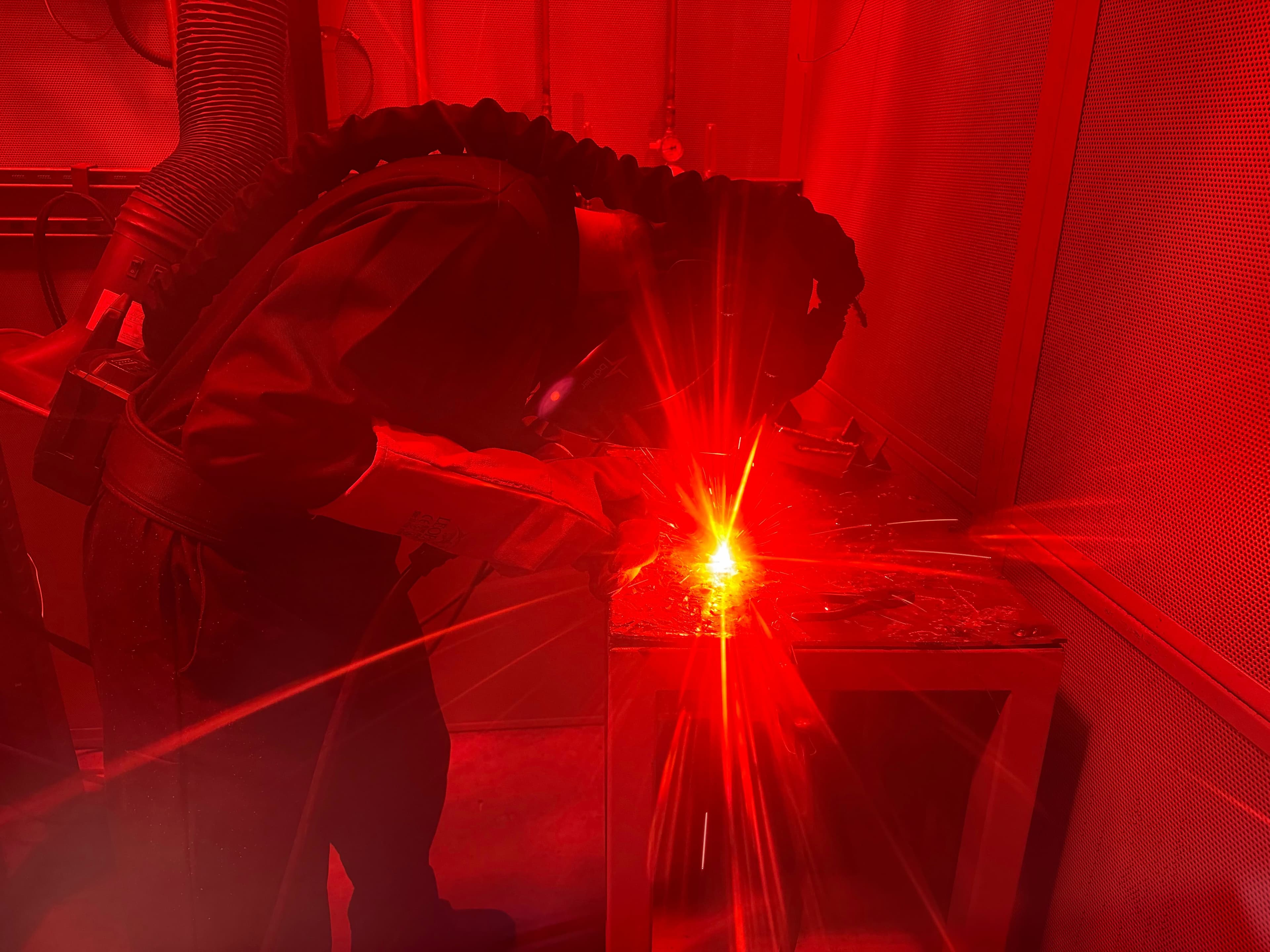Subco engineer behind the weld bay curtains